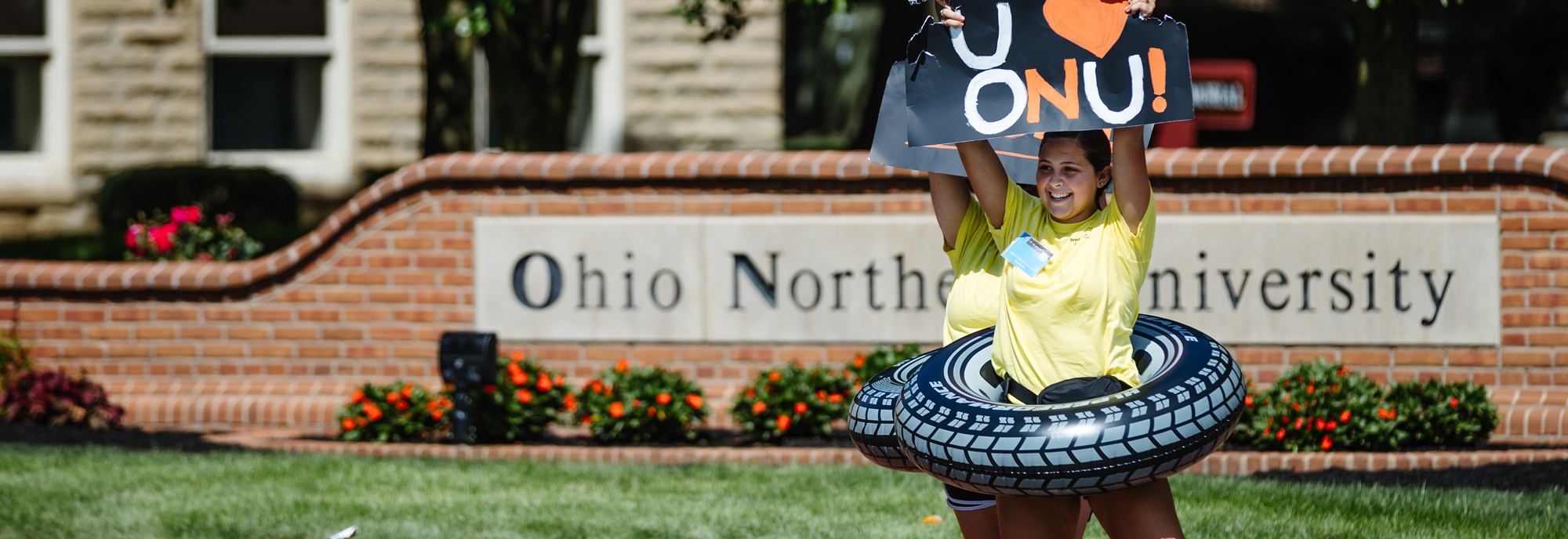 students welcoming new students to campus