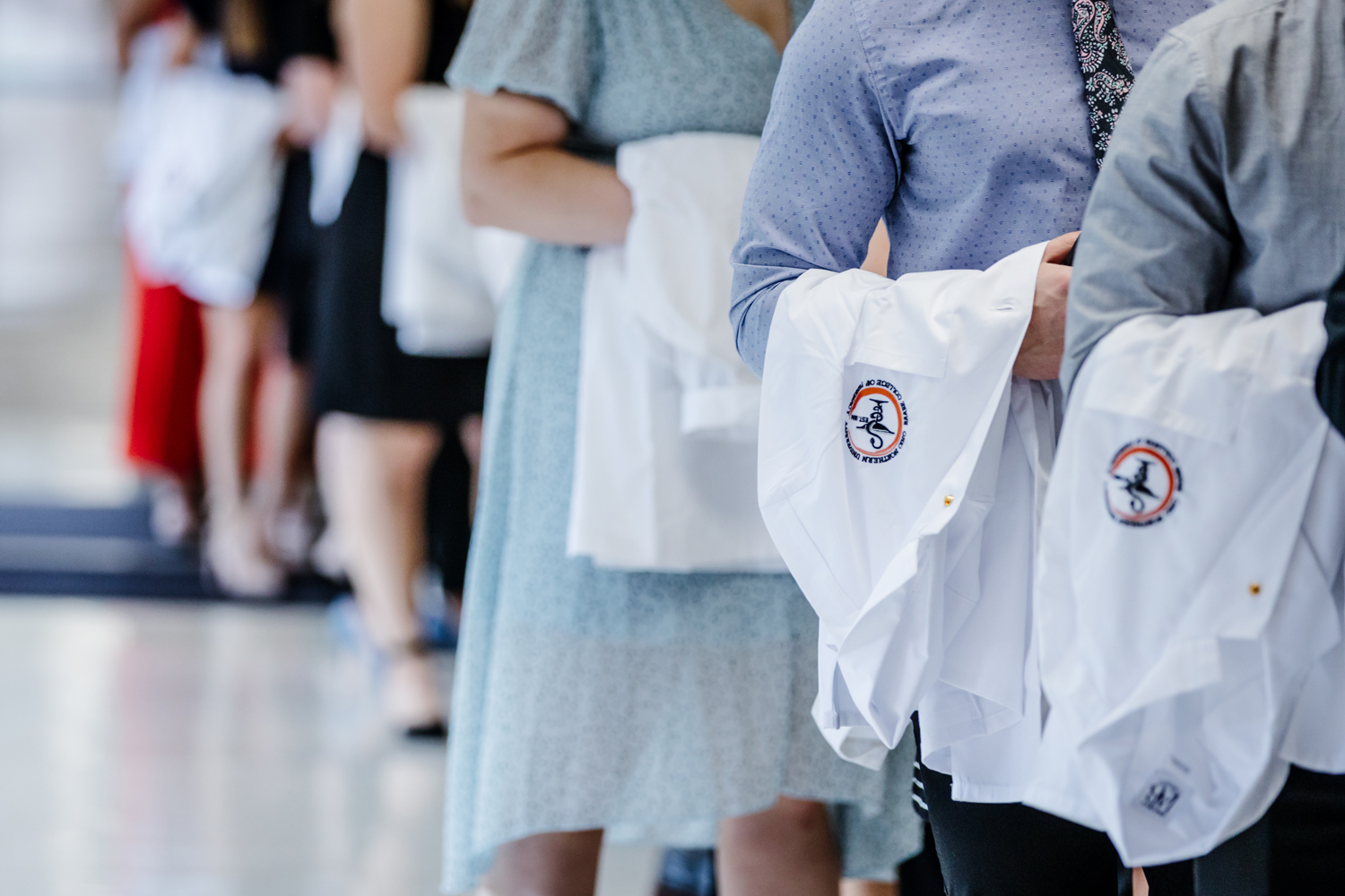 students receiving their white coat