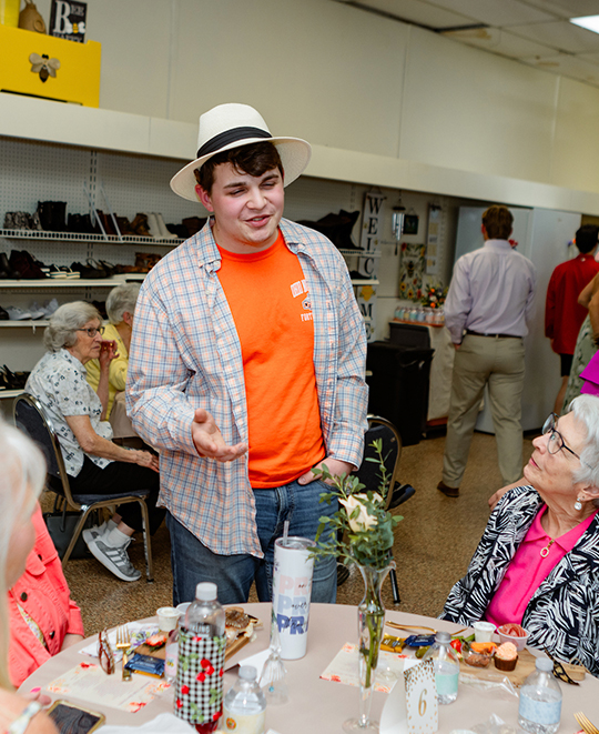 Photo of ONU student who was in the fashion show talking with audience