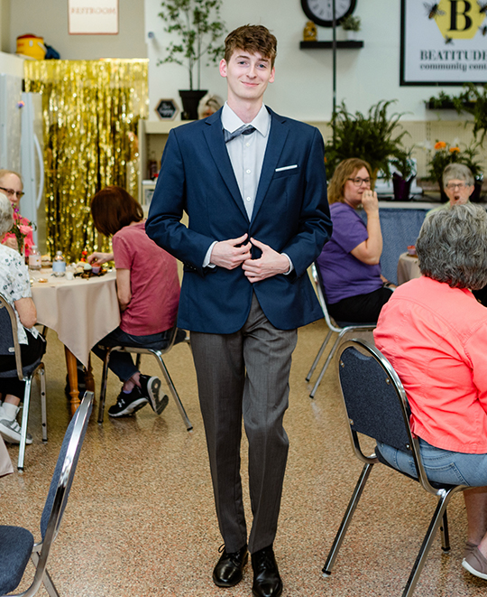Photo of male ONU student walking the fashion runway