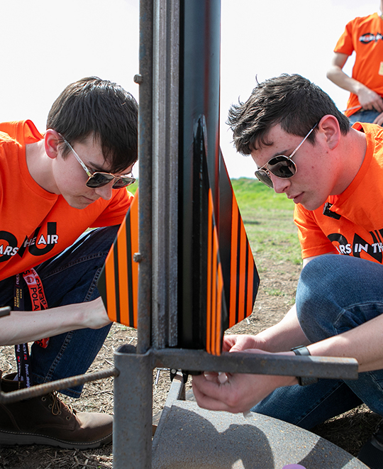 Photo of ONU students working on a rocket 