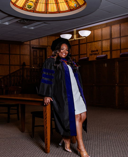 Photo of Aleeia posing inside a courtroom