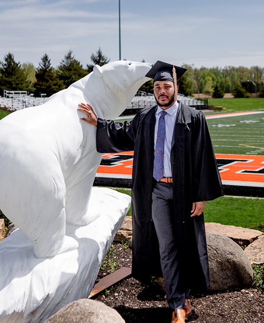 Photo of John posing next to Polar Bear Statue