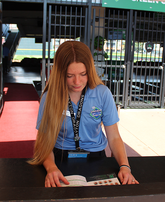 Photo of Chloe working under a tent