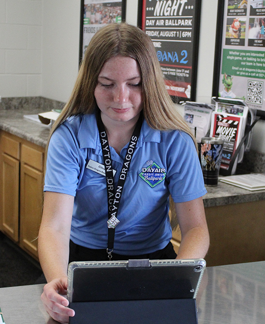 Photo of Chloe working on touchscreen