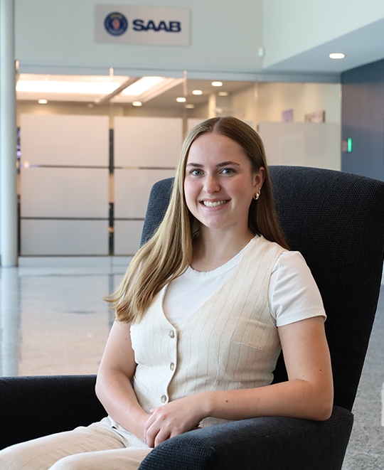 Photo of Rylie sitting in a comfy chair 