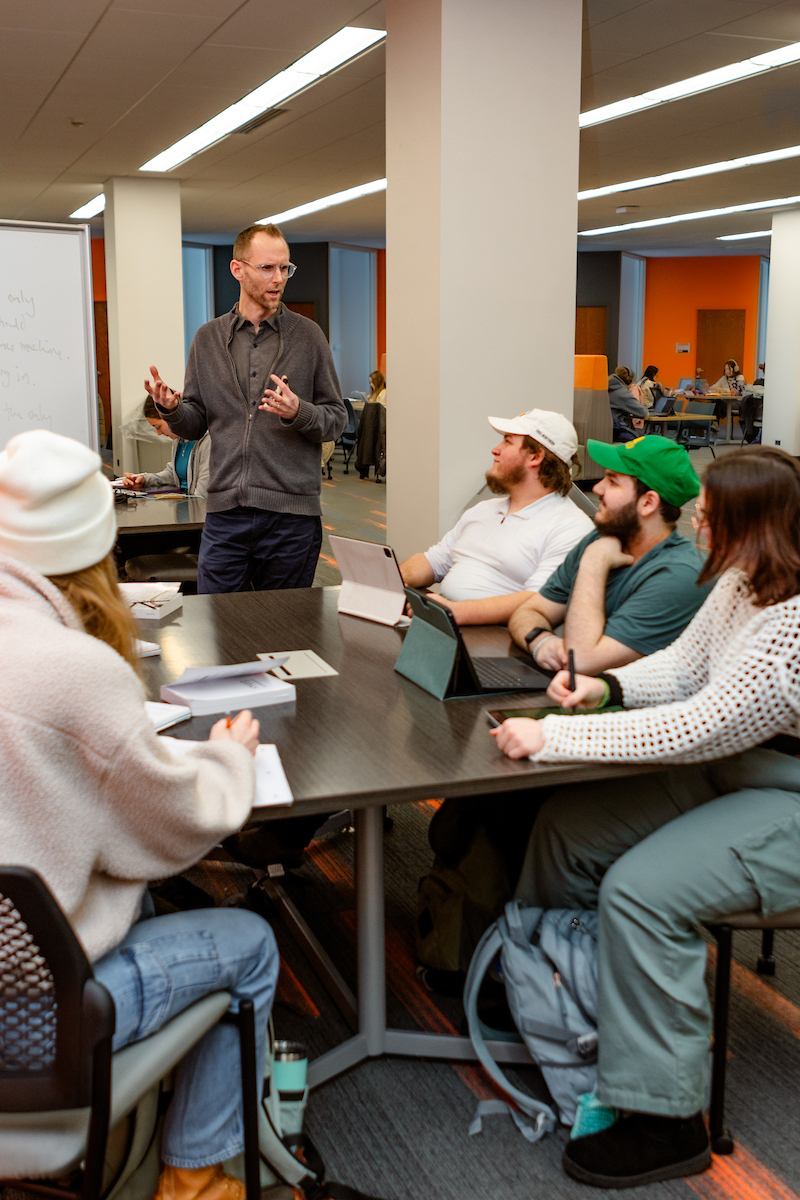 Students working with professor