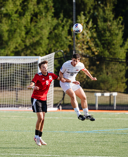 Photo of ONU men soccer player jumping in the air for the header