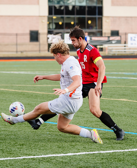 Photo of ONU men soccer player attempting to steal the ball
