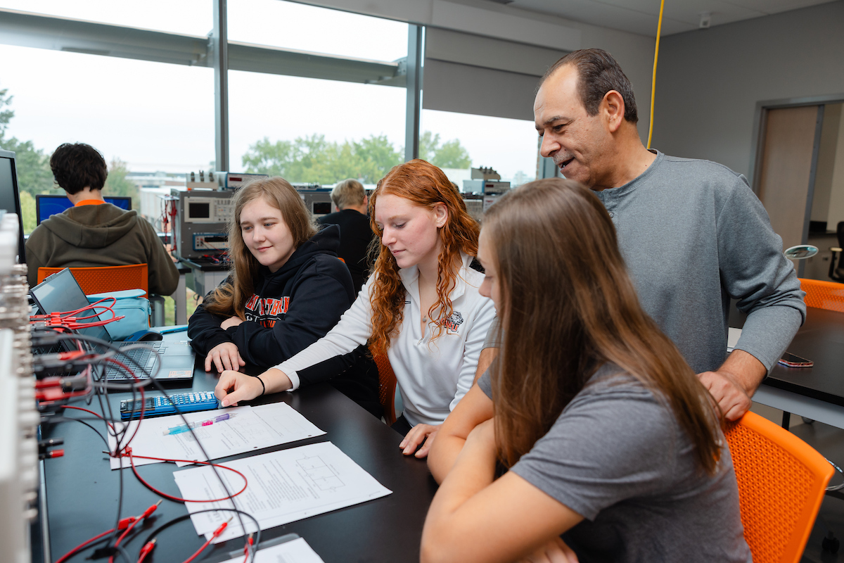 Professor helping in lab