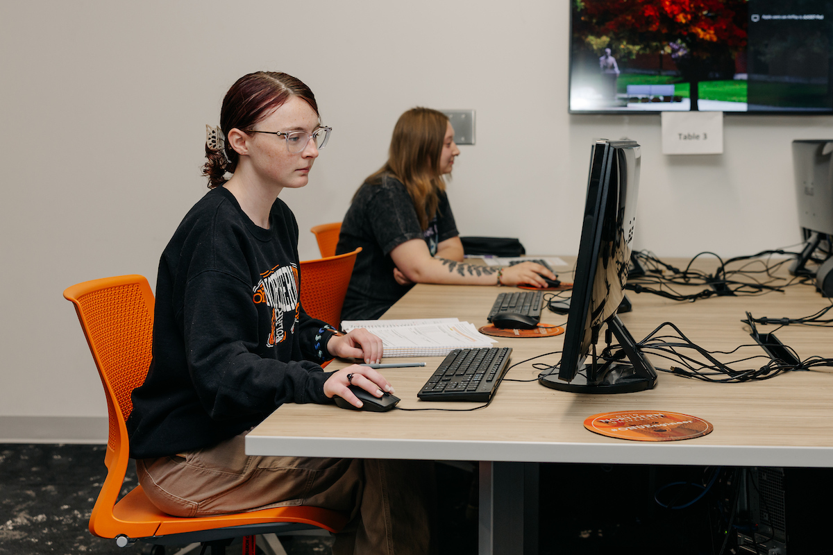 Students writing code