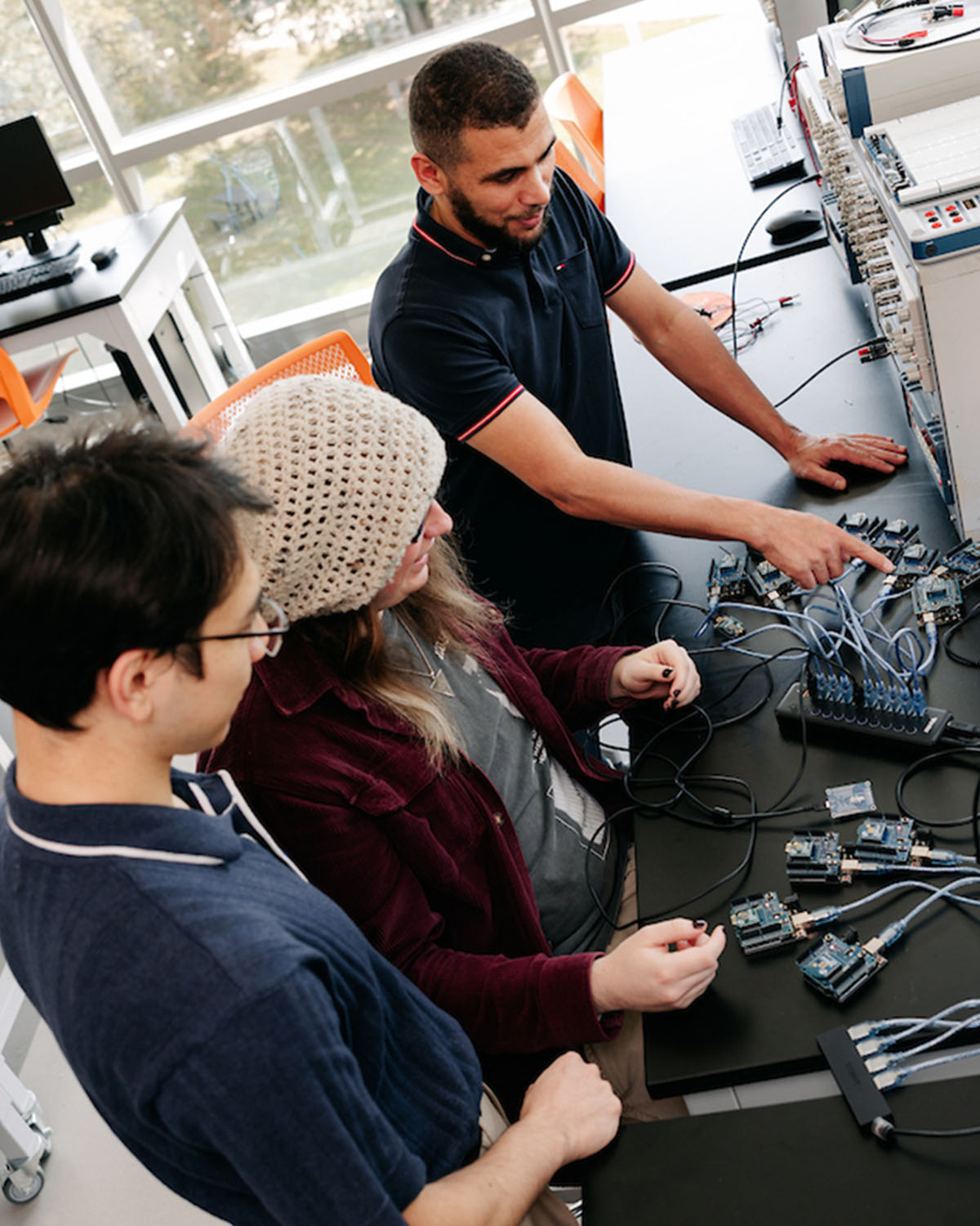 professor working on project with students