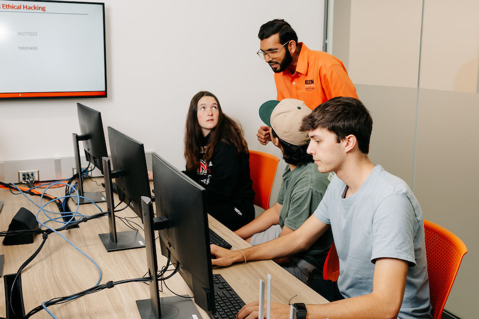 Professor helping students in class
