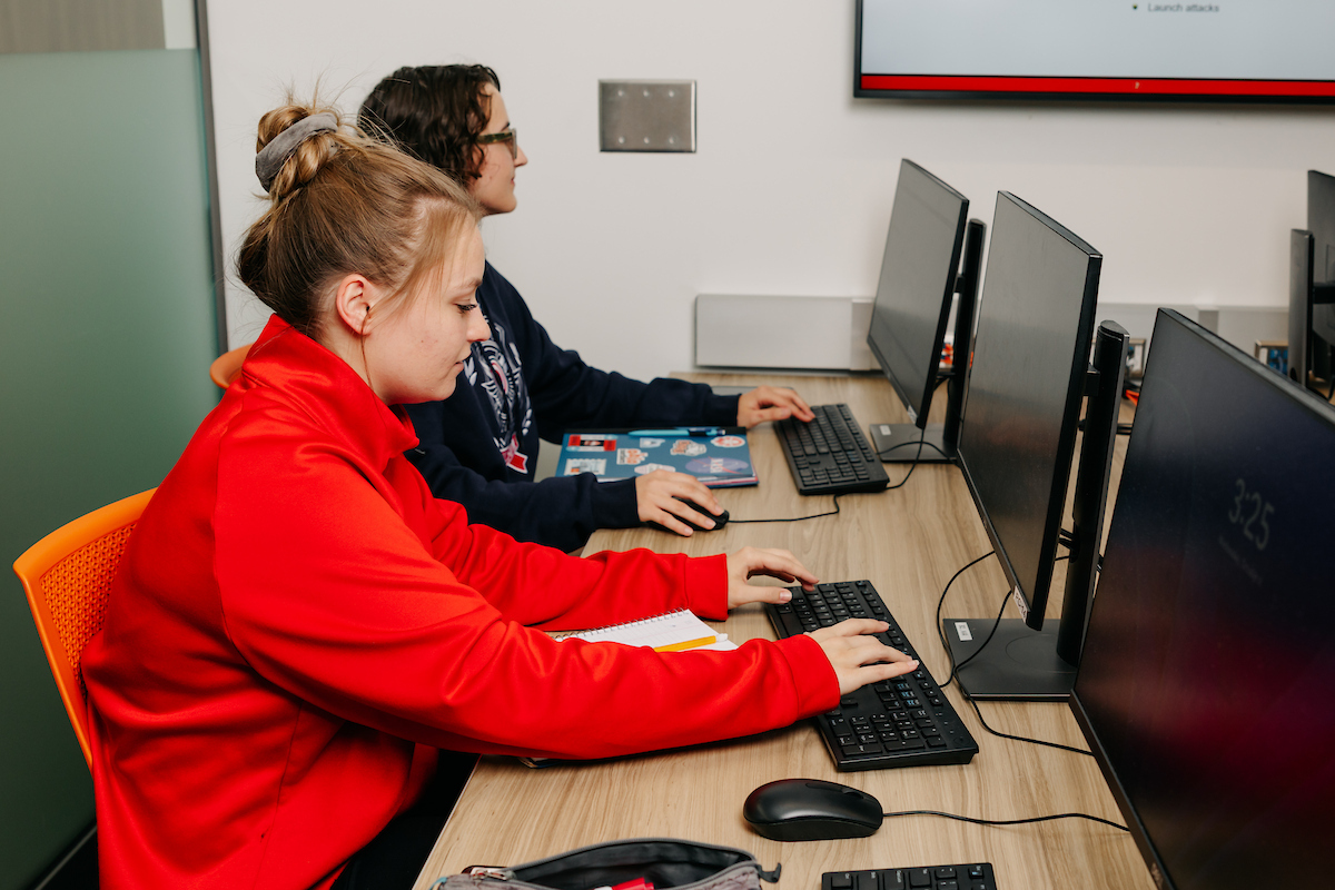 Two female engineering students working in class