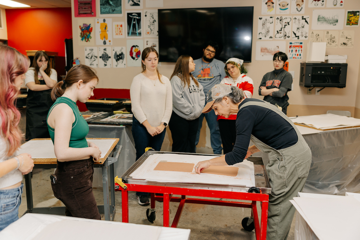 Students learning the art of papermaking