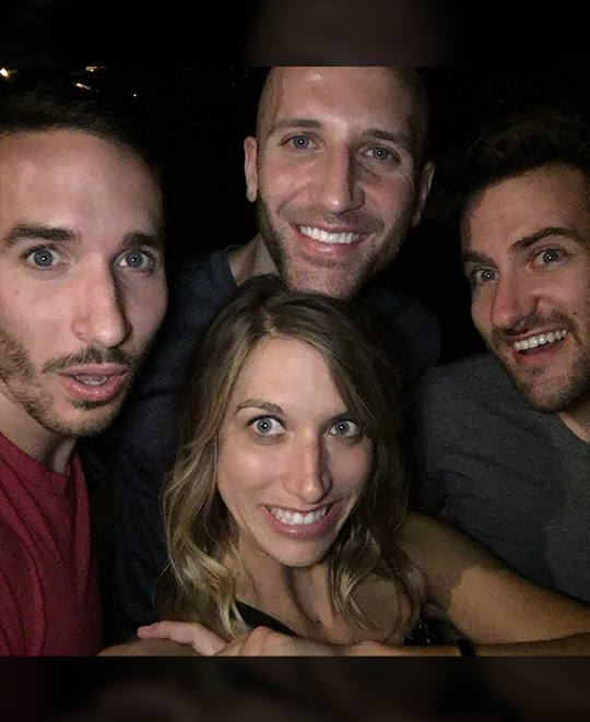 Photo of 4 of the friends out at night together