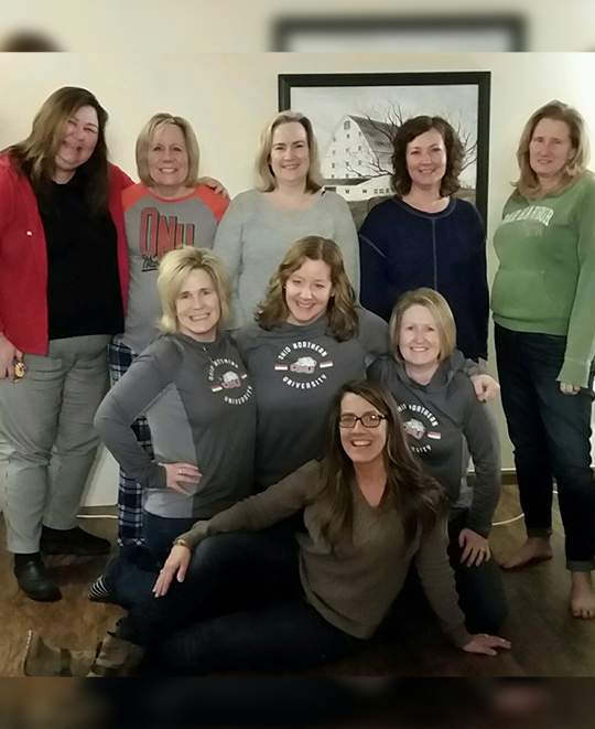 Photo of 9 friends posing together