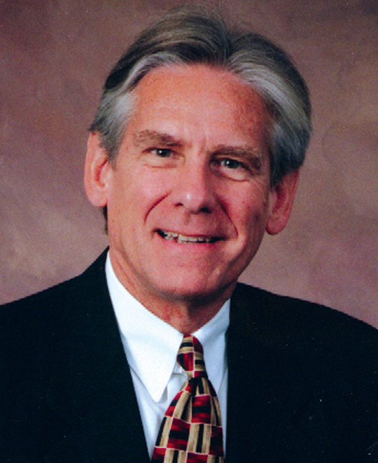 A professional photo of Dr. Baker