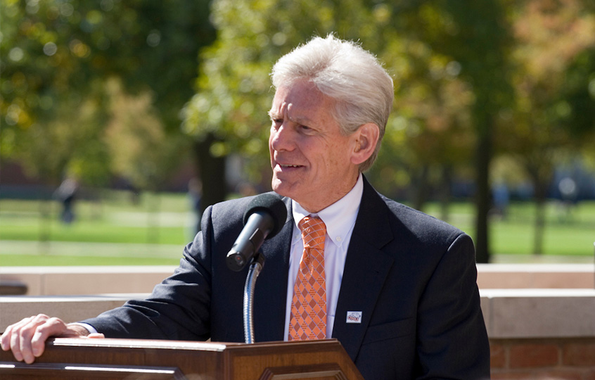 Photo of Baker giving a speech at a podium