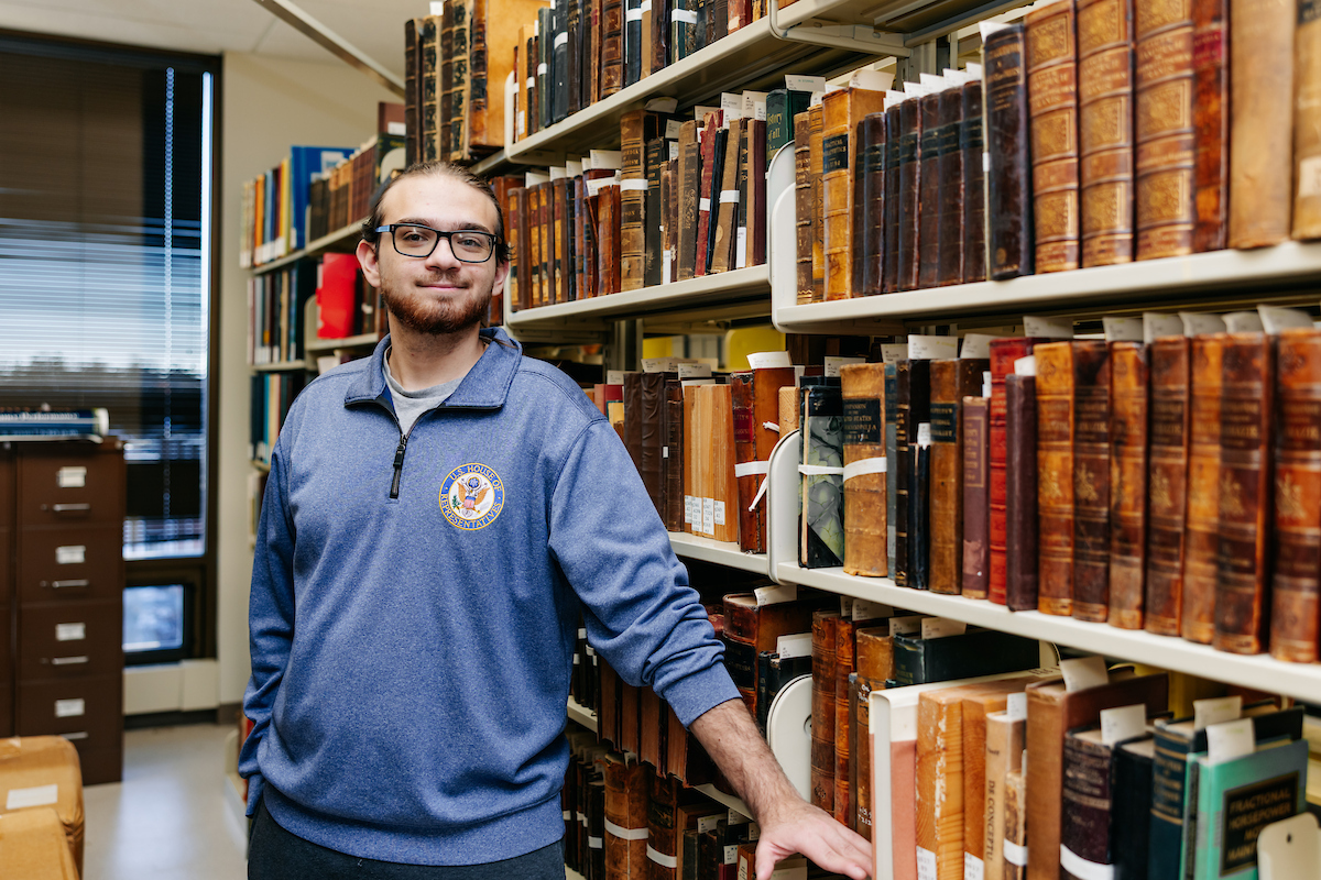 student with the archives