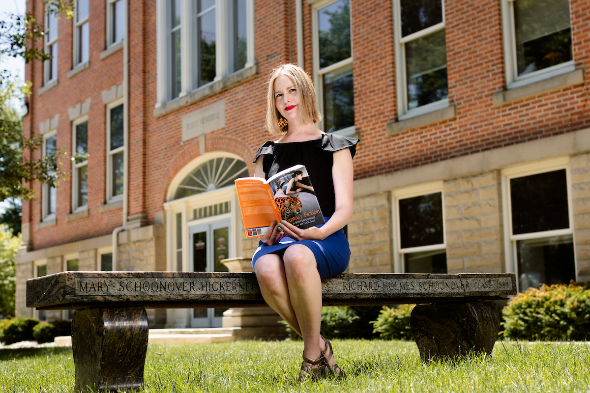 Jen Pullen posing with her book