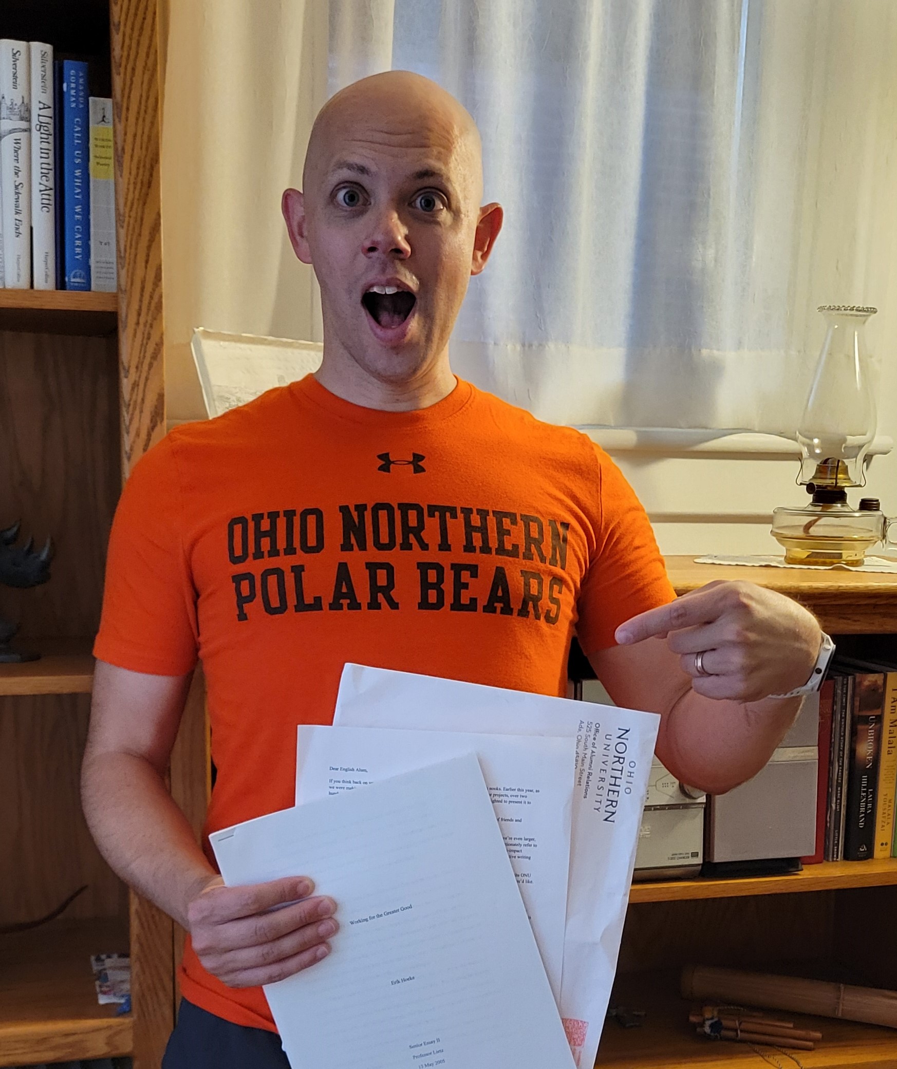 alum posing with his rediscovered project