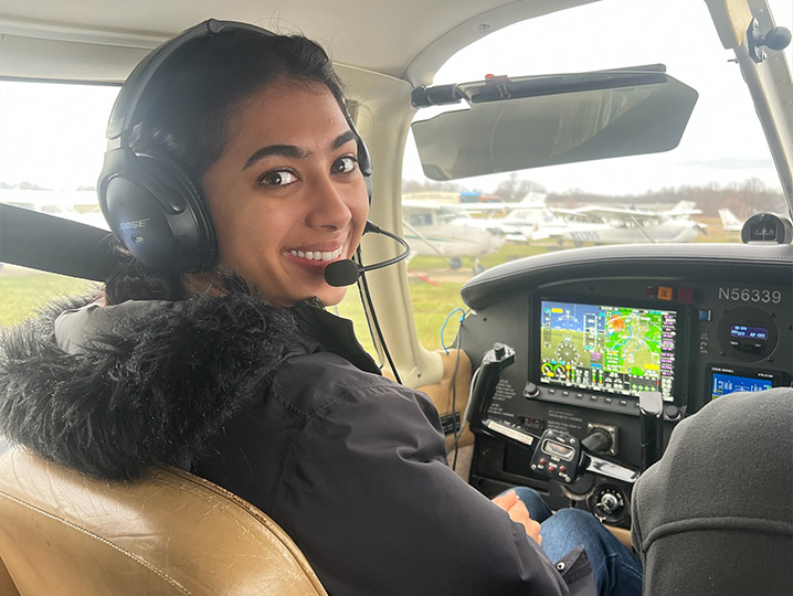 ONU student, Simran seated in the cockpit