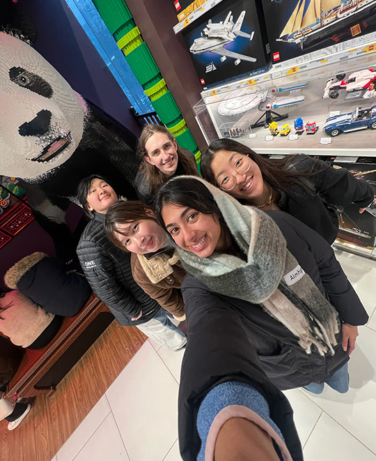 .5 selfie photo of a group of 5 people in the China Adidas store