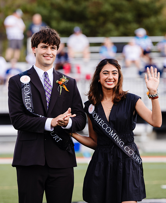 football sidelines with her partner