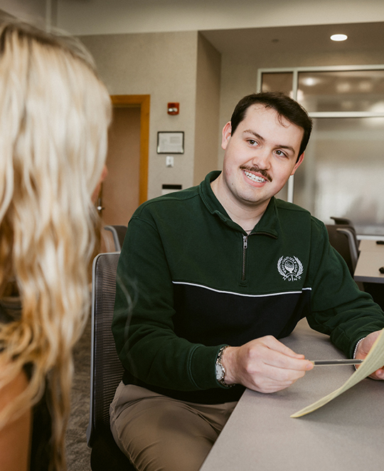 Justin showing someone about their tax document