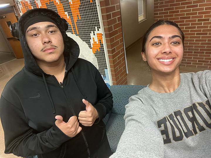 2 friends posing together for a selfie