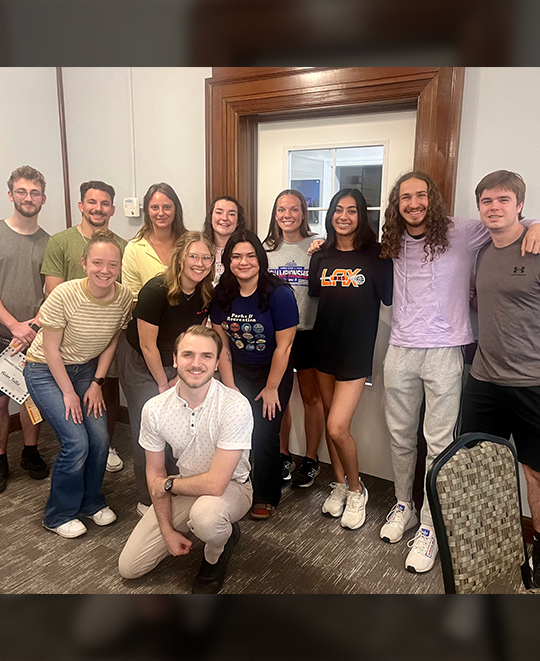 Big group posing together in 3 levels