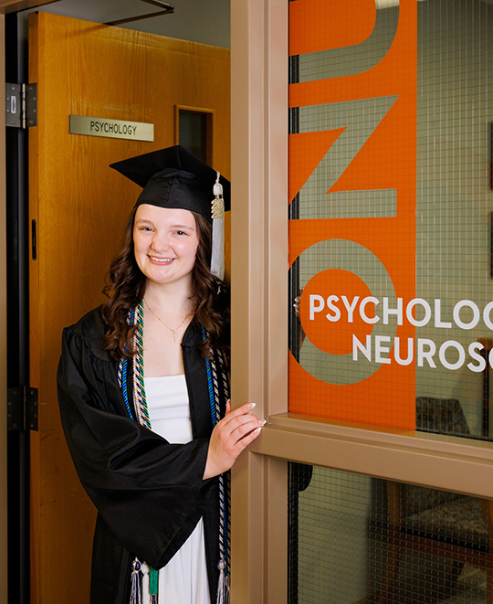 Julia standing in the ONU psychology doorway