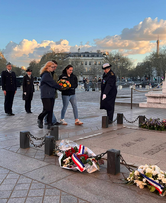 Ohio Northern University students at the base of the Arc de Triomphe in Paris during a commemorative ceremony.