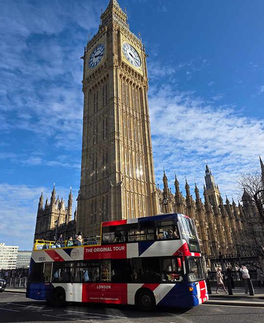 Ohio Northern University students posing in front of the Big Ben clock tower and the Palace of Westminster in London during their "Walking Through History" trip.