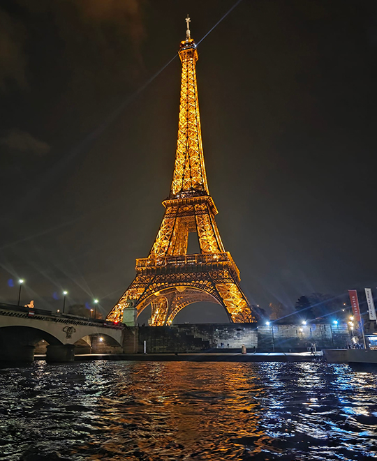 ONU history students and faculty visiting the Eiffel Tower in Paris, France.