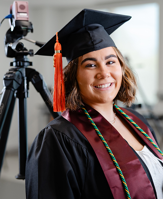 Madison in her graduation cap and gown