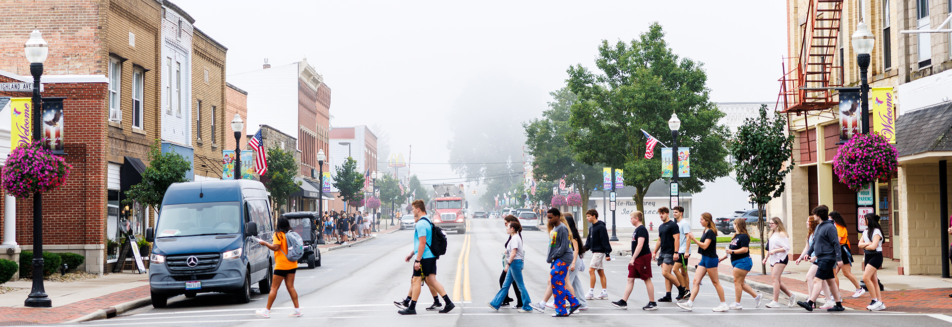 ONU students walking across a street in Ada