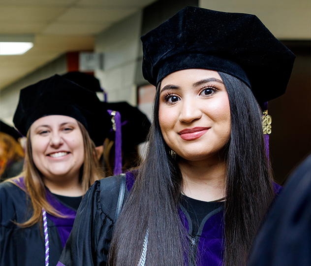 2 ONU students wearing their law graduation hat