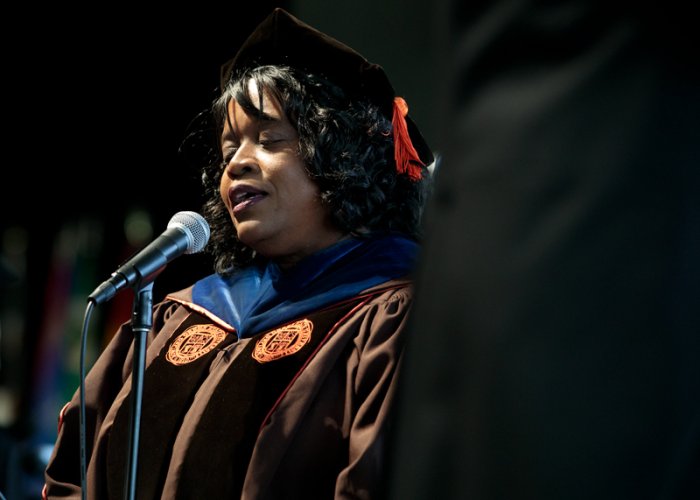 Adriane Thompson-Bradshaw singing at graduation