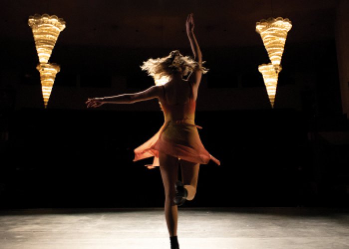 Student dancing on stage