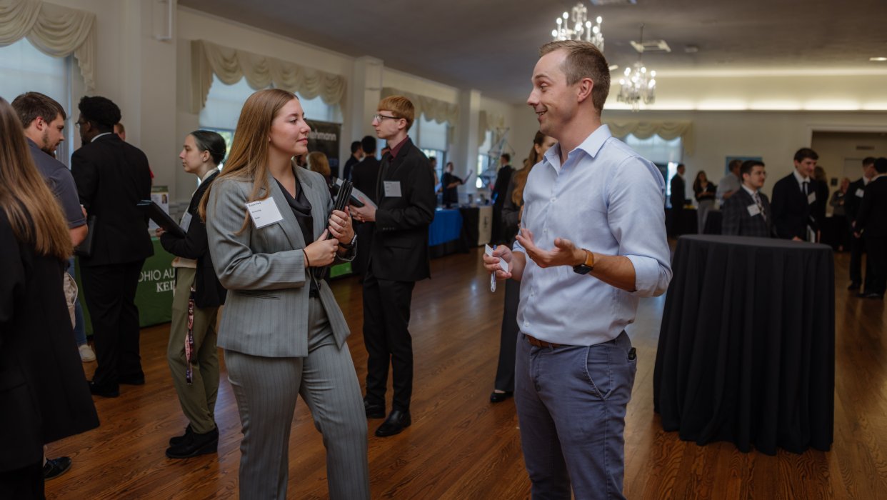 Photo of 2 adults chatting