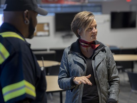 Woman talking to employees