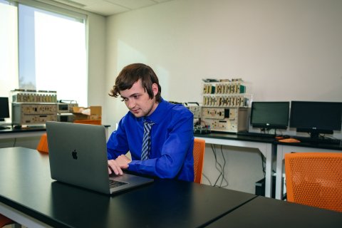 Photo of Michael working on his laptop