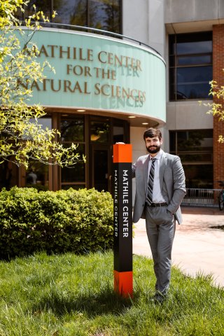 Photo of Brenton in front of onu building