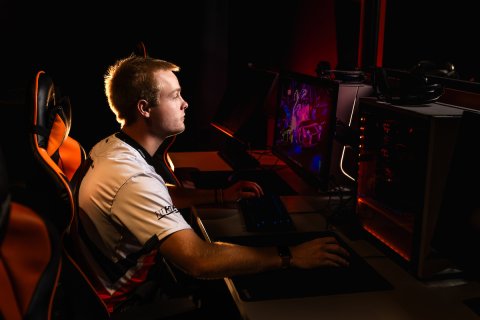 Photo of Kaden at a computer