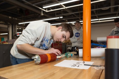 Photo of ONU student working on his rocket