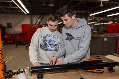 Photo of ONU student looking over his rocket