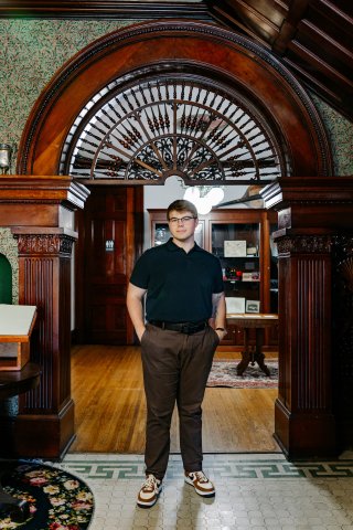 Photo of Jacob with his hands in his pant pockets