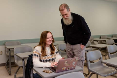 Photo of Ray person with a single student